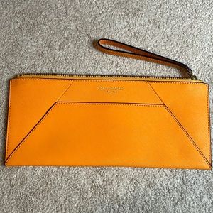Henri bendel orange leather clutch